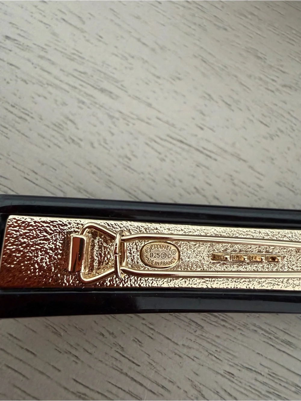 CHANEL Black Resin Hair Clip with Gold Crystal CC Logo